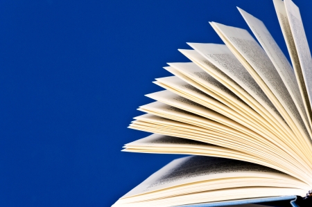 Opened book on the blue の写真素材