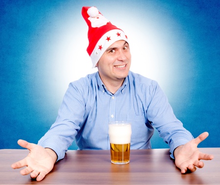Santa is happy with the glass of beerの写真素材
