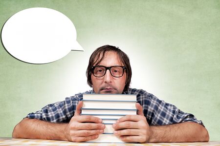 Selfishly a man holding a book for himself
