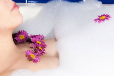 Female in the bath with the flowers