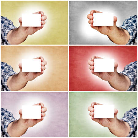 Hand and blank white cards in different colors