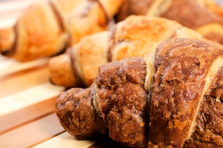 Selective focus on the right chocolate croissantの写真素材