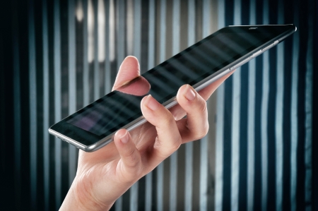 New Generation tablet in the female hand in low key techniqueの写真素材