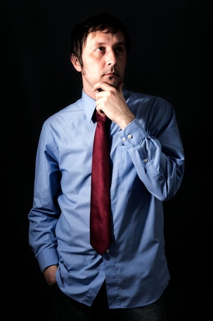 Businessman thinking in low key technique lightの写真素材