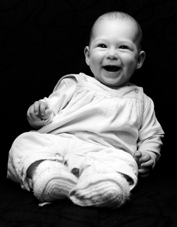 Portrait of little baby girl in low key technique and converted in black and whiteの写真素材
