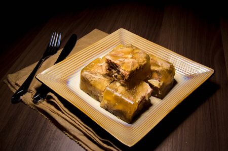 Gelatin pork meat on the table. Shoot in a long exposure.の写真素材