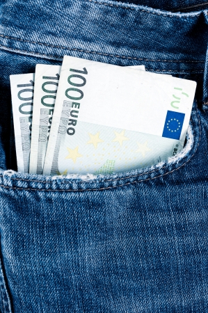 Euro bills in the jeans pocketの写真素材