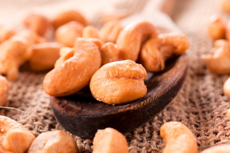 Selective focus on the cashew nuts in ladleの写真素材