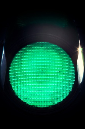 Green sign on the traffic lightの写真素材