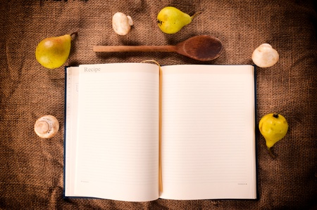 Cookbook with mushrooms and pear from aboveの写真素材
