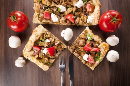 Homemade fresh pie from above on wooden table 