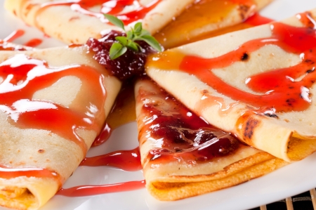 Homemade strawberries jam on the pancakes の写真素材