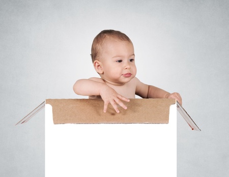 Funny baby in the blank boxの写真素材