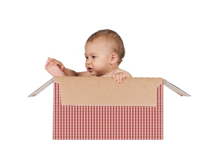 Happy baby in the box isolated on white backgroundの写真素材