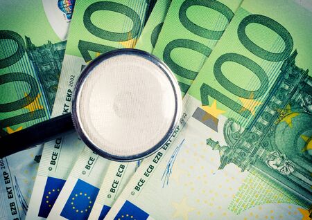 One hundred euro bills and stethoscope の写真素材