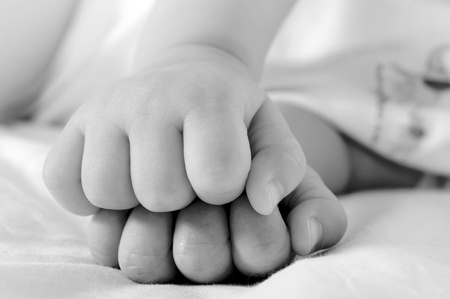 Little baby fists in black and whiteの写真素材