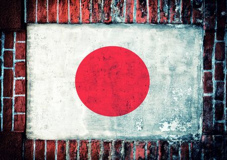 Flag of Japan in the old bricks windowの写真素材