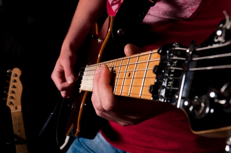 Man playing guitar in low key technique 