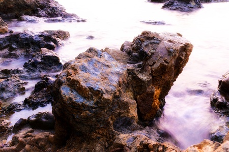 Big stone and sea water in long exposureの写真素材