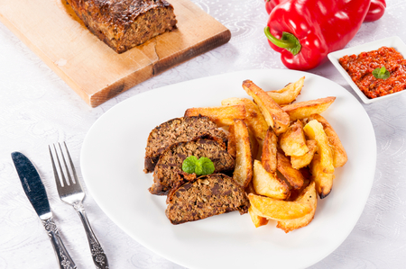 Traditional Serbian lamb meat with fried potato in the plateの写真素材