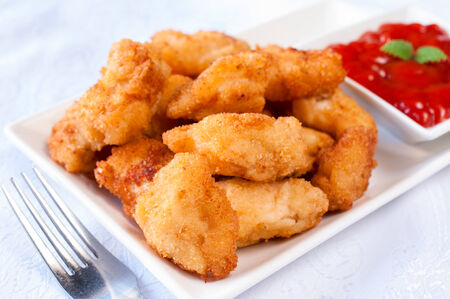 Homemade fried chicken nuggets with ketchupの写真素材