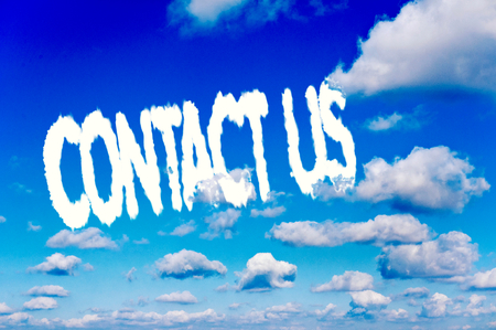 Contact us writen on the dark blue skyの写真素材