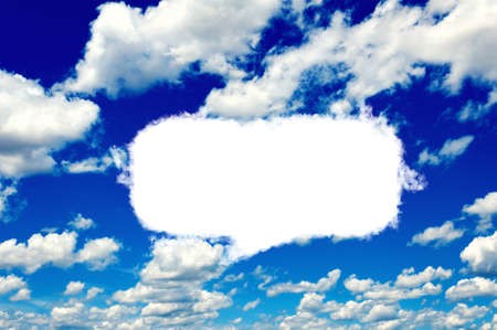 Blank speech cloud shape on clear blue sky 