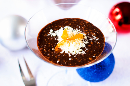 Dark chocolate and crushed nuts in the fancy glassの写真素材