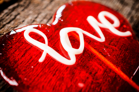 Selective focus on the letter L on heart shape lolly popの写真素材