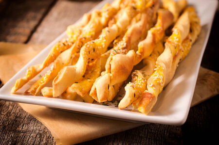 Selective focus in the middle of front homemade sticks with sesame and cumin