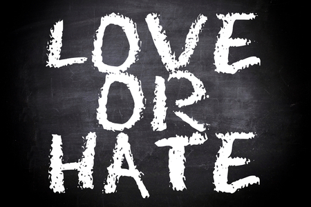 Love or hate text on the chalkboardの写真素材
