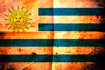 Old creased paper with Uruguay flagの写真素材