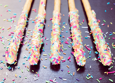 Baked sweet sticks with colourful crumbs.Selective fcous in the middle の写真素材
