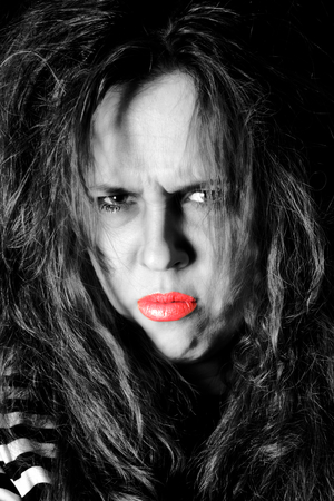 Portrait of sad female, low key and selective color techniqueの写真素材