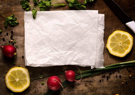 Food background with blank paper in the middle 