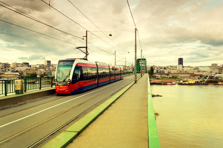 Modern tram on the bridge in Belgrade city.Blurred motion of tramのeditorial素材