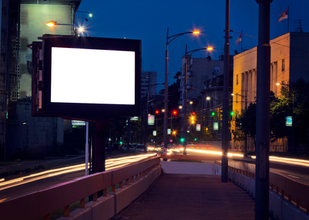 Big blank city billboard at night in long exposure の写真素材