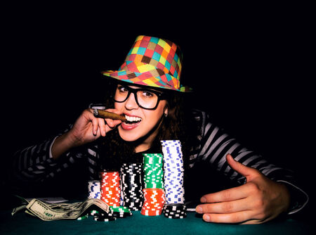 Happy female face on the poker game.selective focus on the female head 