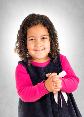 Portrait of positive little girl with smile on her face の写真素材