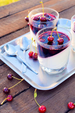 Selective focus on the front glass stuffed with panna cotta dessertの写真素材