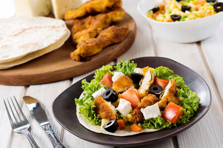 Selective focus on the front chiciken meat on tortilla bread の写真素材