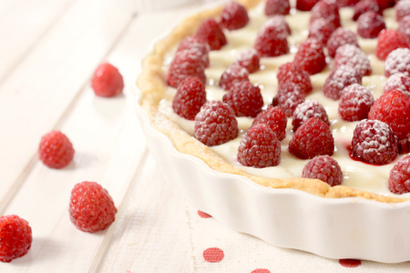 Fresh raspberries on the tart with vanilla pudding.Selective focus on the front raspberries の写真素材