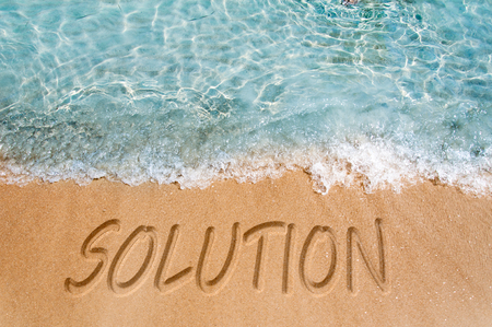 Solution word sign on the beach sand