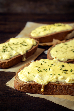Selective focus on the front dark bread with melted cheese on top の写真素材