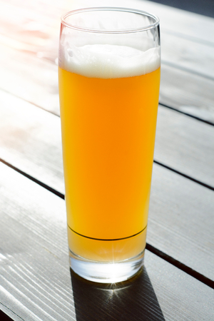 Glass of German beer on woden background,selective focusの写真素材