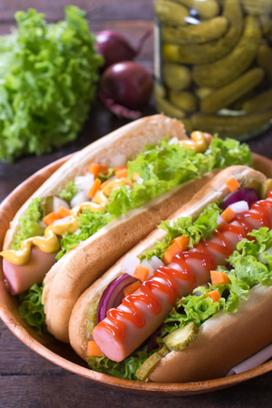 Hot dogs with mustard and ketchup in the bun,selective focusの写真素材