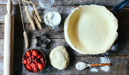 Concept of preparing the red fruit pie from above,selective focusの写真素材