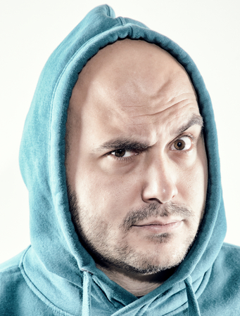 Portrait of a man with a suspicious look