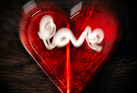 Blurred explosion of hearts with love signの写真素材