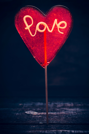 Heart shape lollypop with handmade love sign,selective focusの写真素材